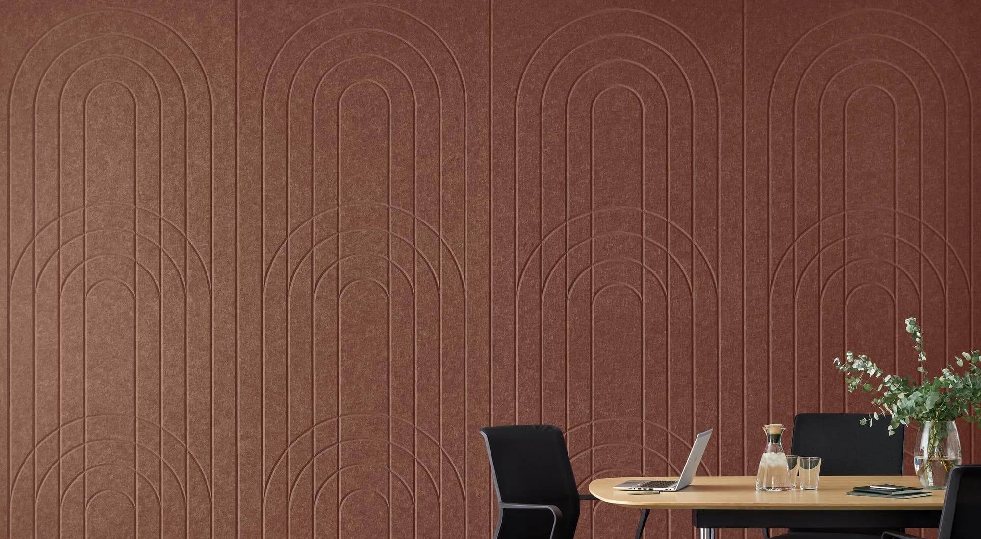 EchoPanel Empire 3D acoustic wall panels in warm terracotta, shown behind a modern workspace
