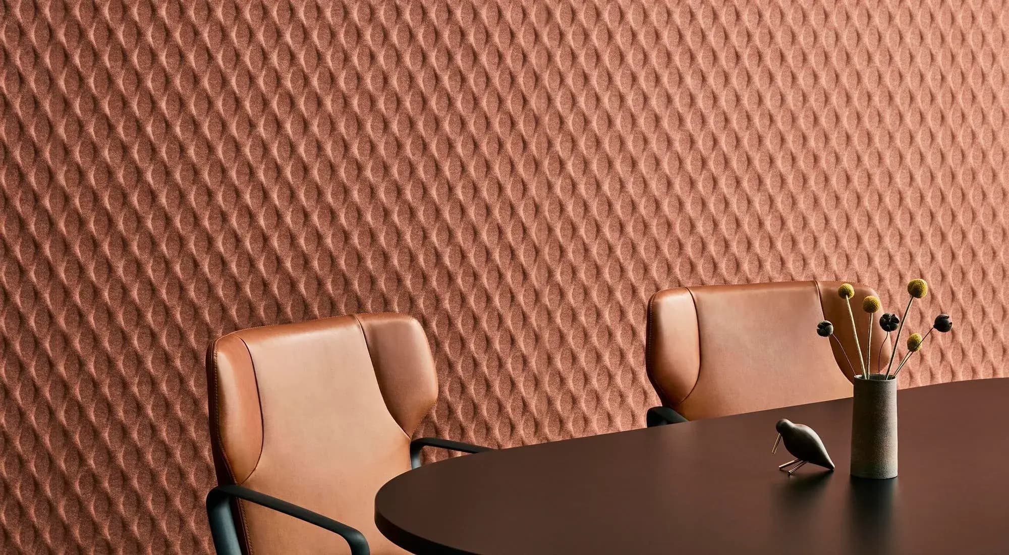Gem embossed acoustic panels in terracotta with a diamond texture, shown in a meeting room