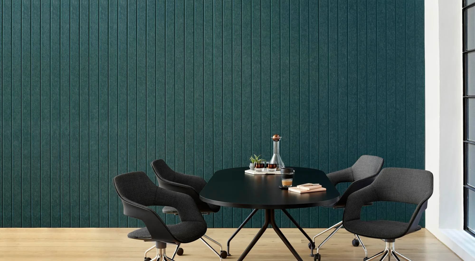 EchoPanel Longitude acoustic wall panels in teal, linear slatted profile behind a dining setting