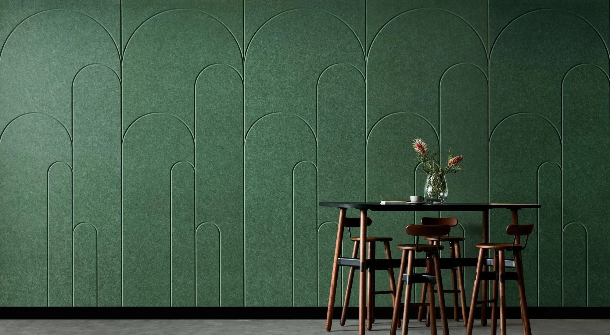 EchoPanel Palace 3D acoustic wall panels in deep emerald green, shown behind a dining setting